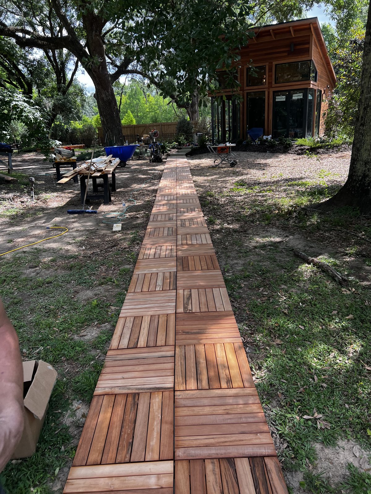 Custom wood tile walkway leading to structure