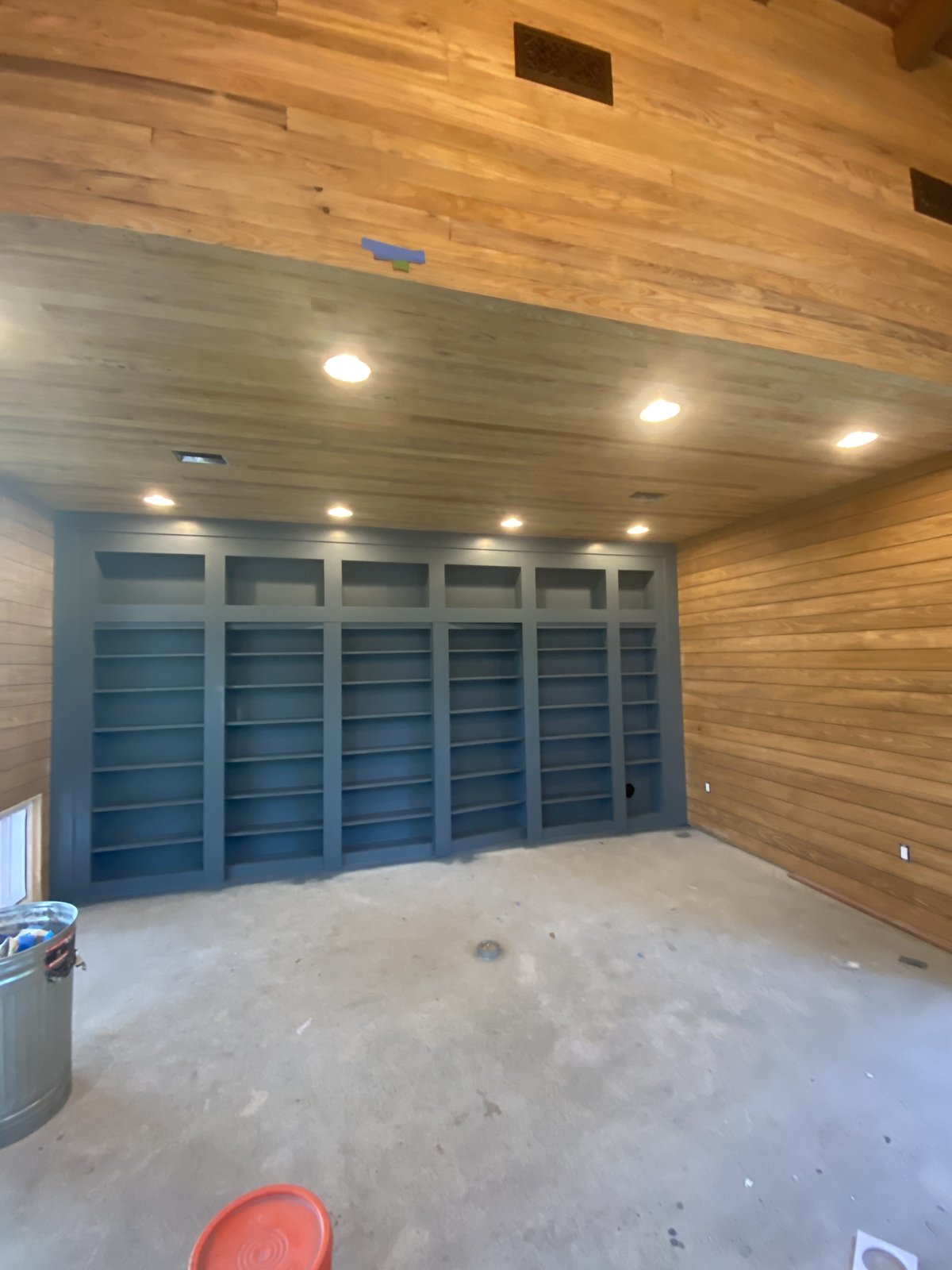 Custom built-in bookshelf wall with recessed lighting