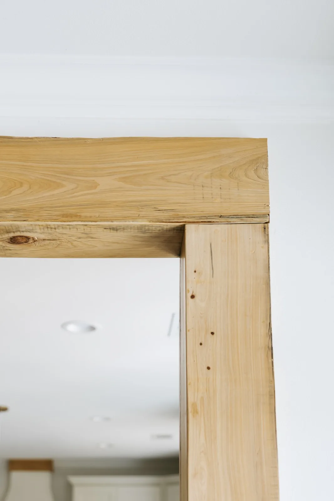 Beam-to-post corner joinery detail — natural cypress with visible character marks