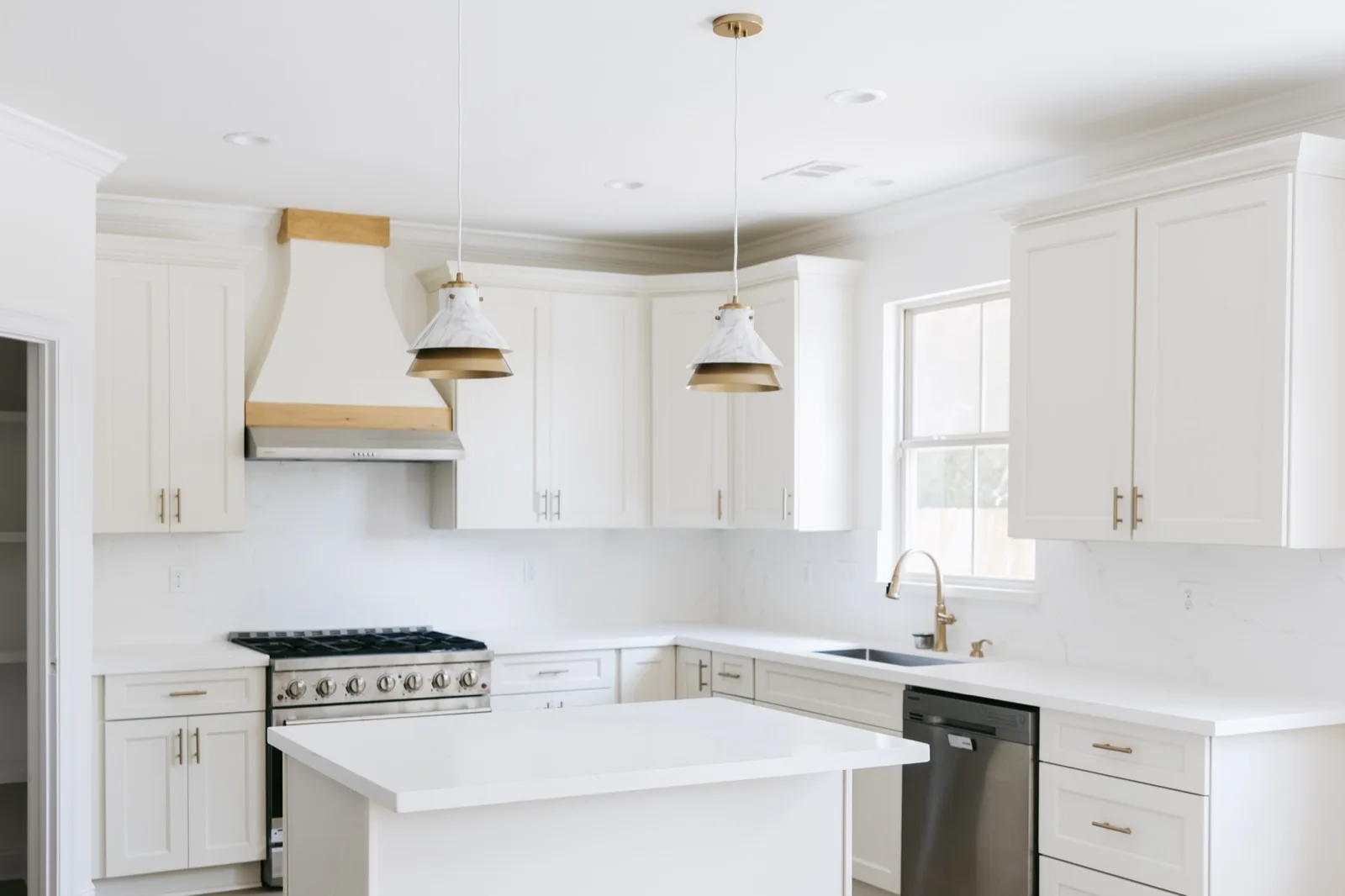 Kitchen alternate perspective showing cabinetry and pendant lights
