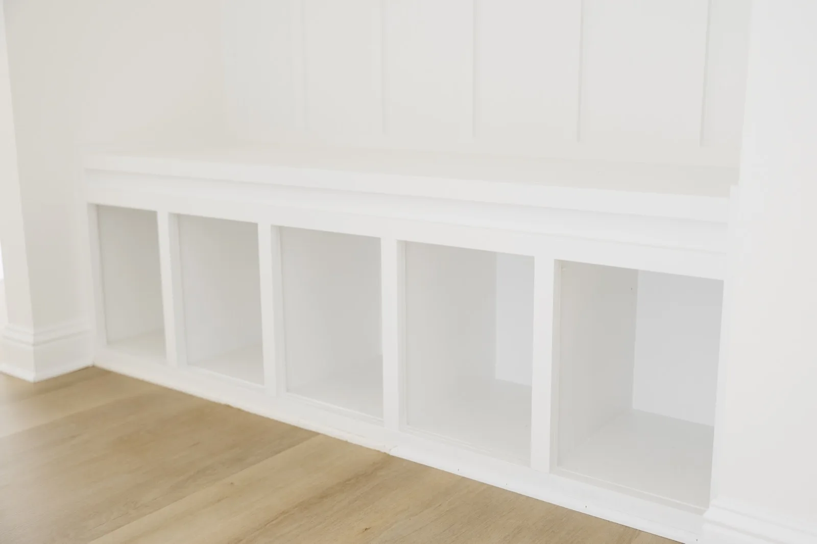 Mandeville luxury renovation — built-in mudroom bench with board-and-batten